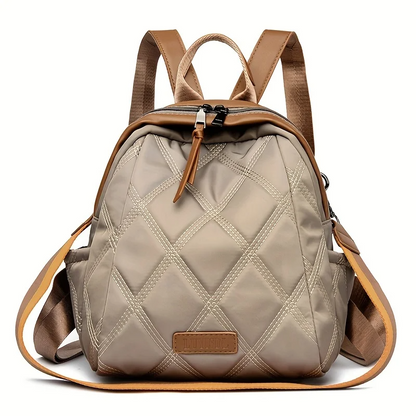 Versatile women's quilted nylon backpack, ideal for travel or everyday as a shoulder bag.