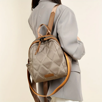 Elegant quilted nylon women's backpack, a convertible fashion accessory and practical shoulder bag.