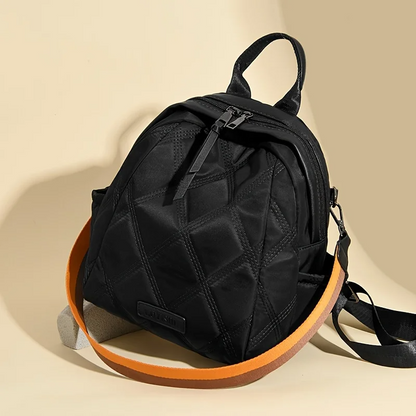 Chic women's quilted nylon backpack, a fashionable and practical accessory for any outfit.
