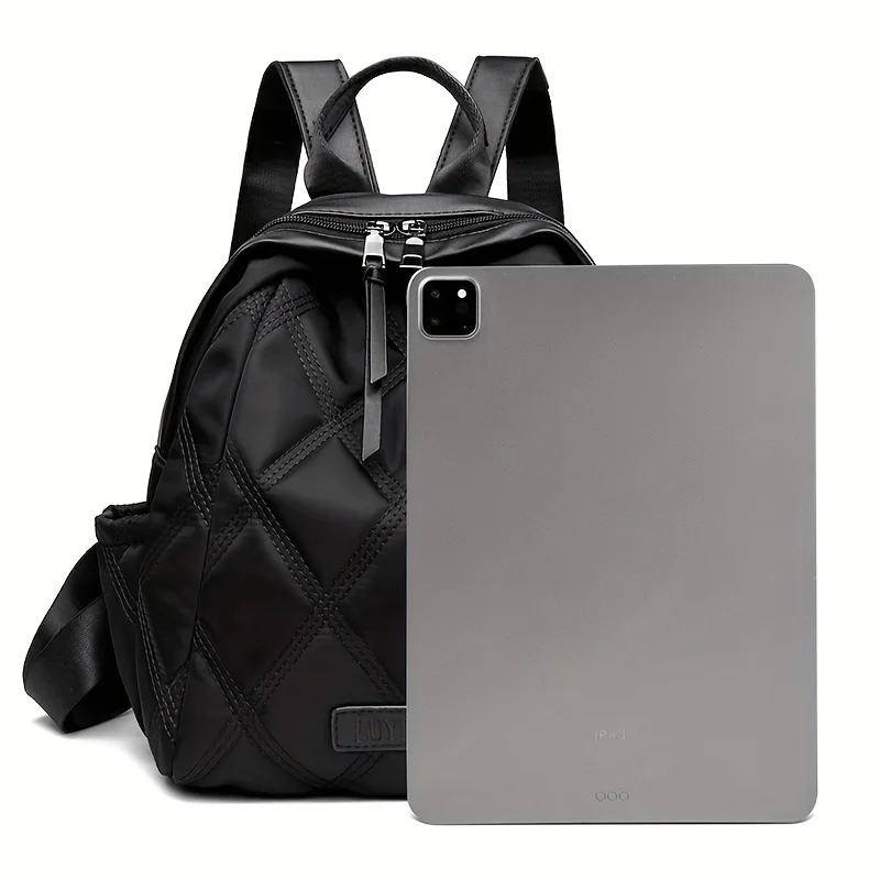 Stylish women's quilted nylon backpack, a versatile everyday bag that converts to a chic shoulder tote.
