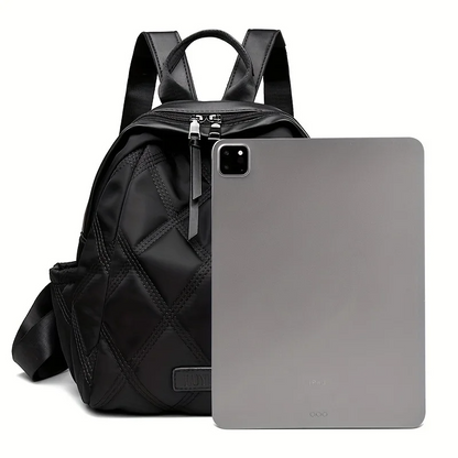 Stylish women's quilted nylon backpack, a versatile everyday bag that converts to a chic shoulder tote.