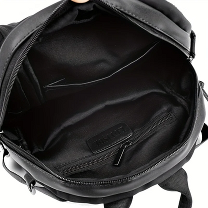 Women's quilted convertible backpack, a versatile nylon bag, perfect as a shoulder bag or travel pack.