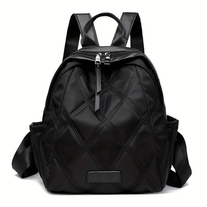 Functional women's quilted backpack, easily converts from a travel pack to a stylish shoulder bag.