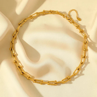 Polished gold link chain necklace, part of an elegant jewelry set for women's fashion.