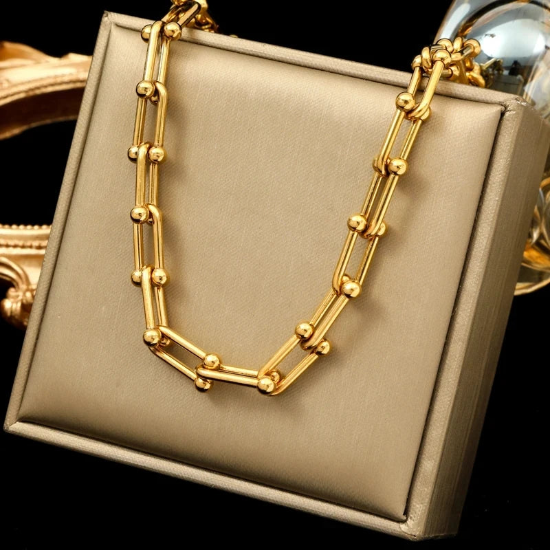 Shimmering radiant gold link chain jewelry set, perfect elegant accessory for women.