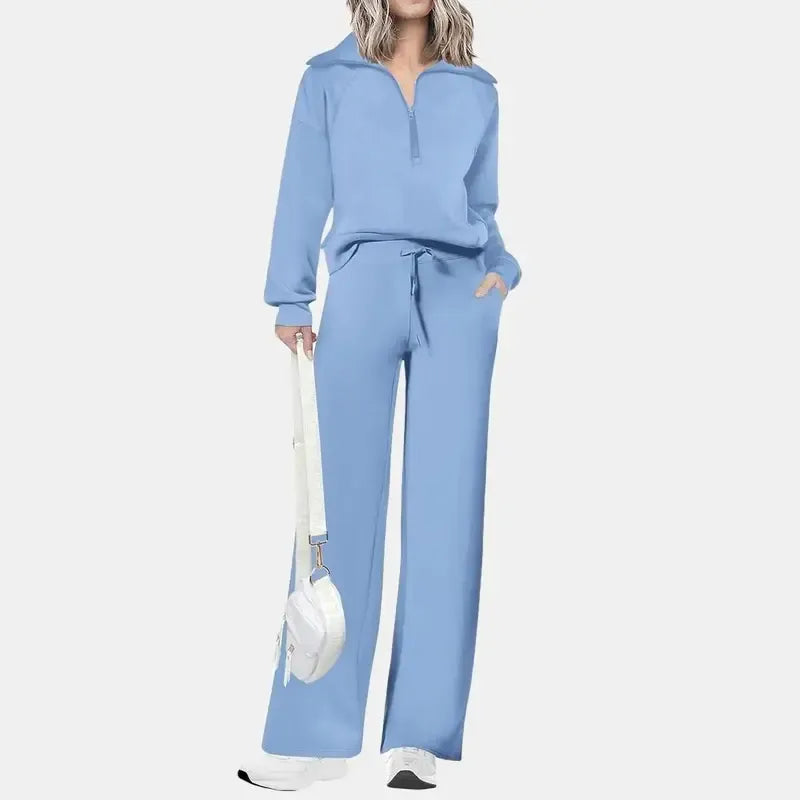 Comfortable women's half-zip two-piece set with wide-leg trousers. Chic casual matching lounge wear.