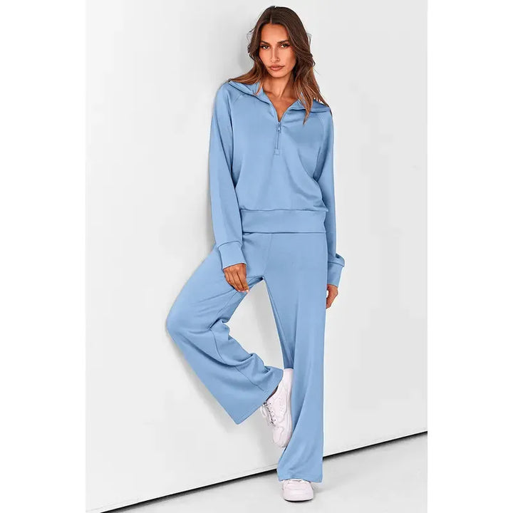 Women's half-zip pullover and wide-leg pant set. Modern two-piece lounge wear for casual elegance.
