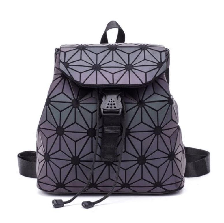 Close-up of a women's reflective geometric backpack, showcasing luminous texture and unique pattern.