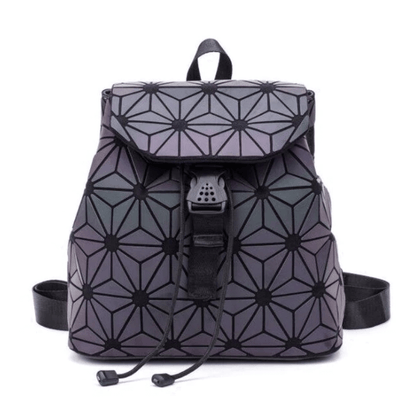 Close-up of a women's reflective geometric backpack, showcasing luminous texture and unique pattern.