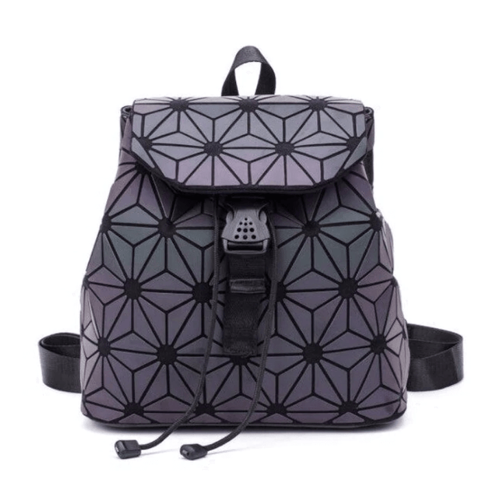 Close-up of a women's reflective geometric backpack, showcasing luminous texture and unique pattern.