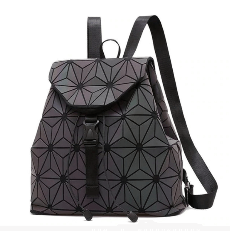 Woman wearing a vibrant reflective geometric luminous backpack, front view, stylish and modern.
