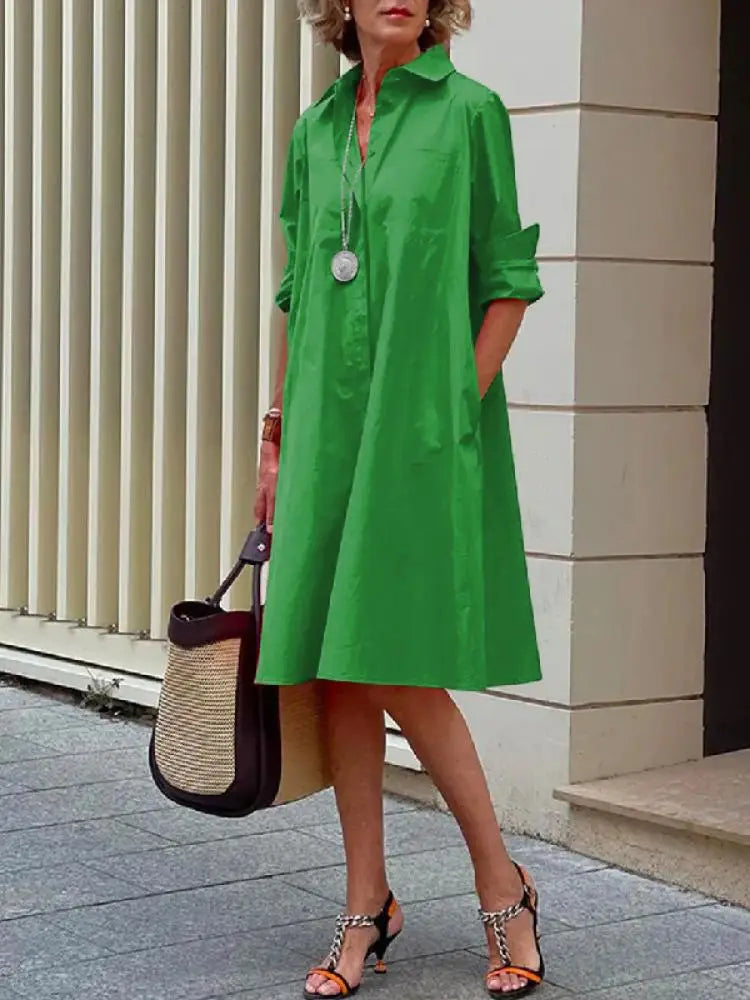 Casual chic women's relaxed fit A-line button-front shirt dress, comfortable midi length for everyday wear.