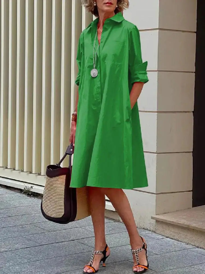 Casual chic women's relaxed fit A-line button-front shirt dress, comfortable midi length for everyday wear.