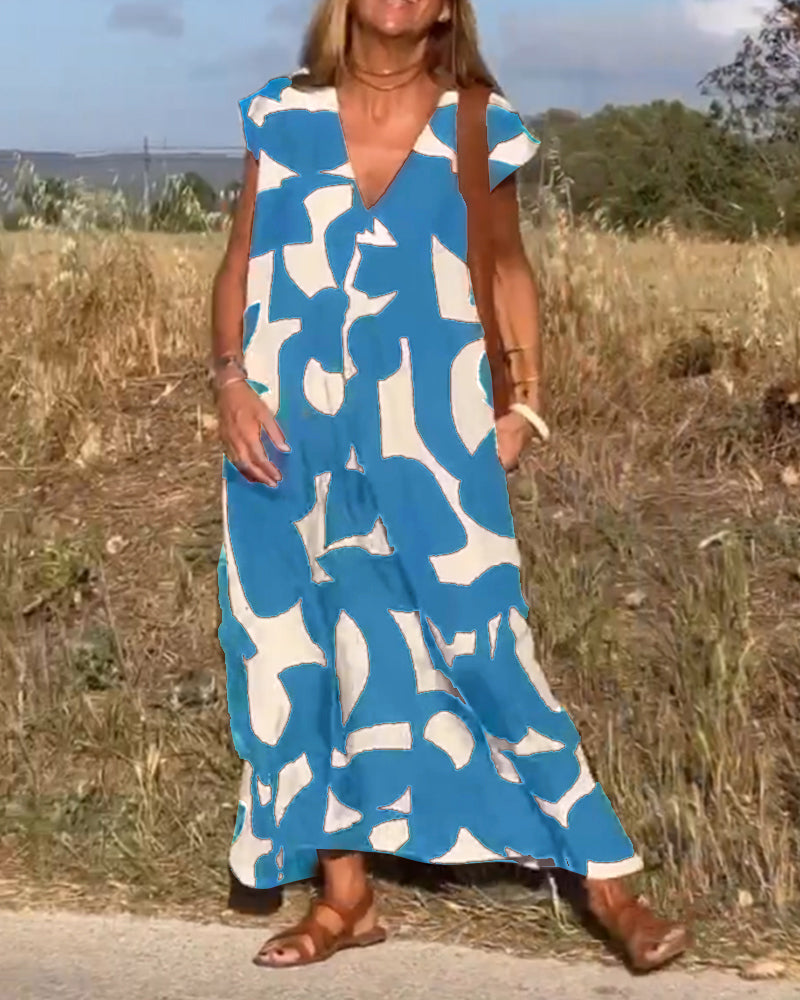 Effortless style women's abstract print dress, featuring a relaxed fit and V-neck for summer.