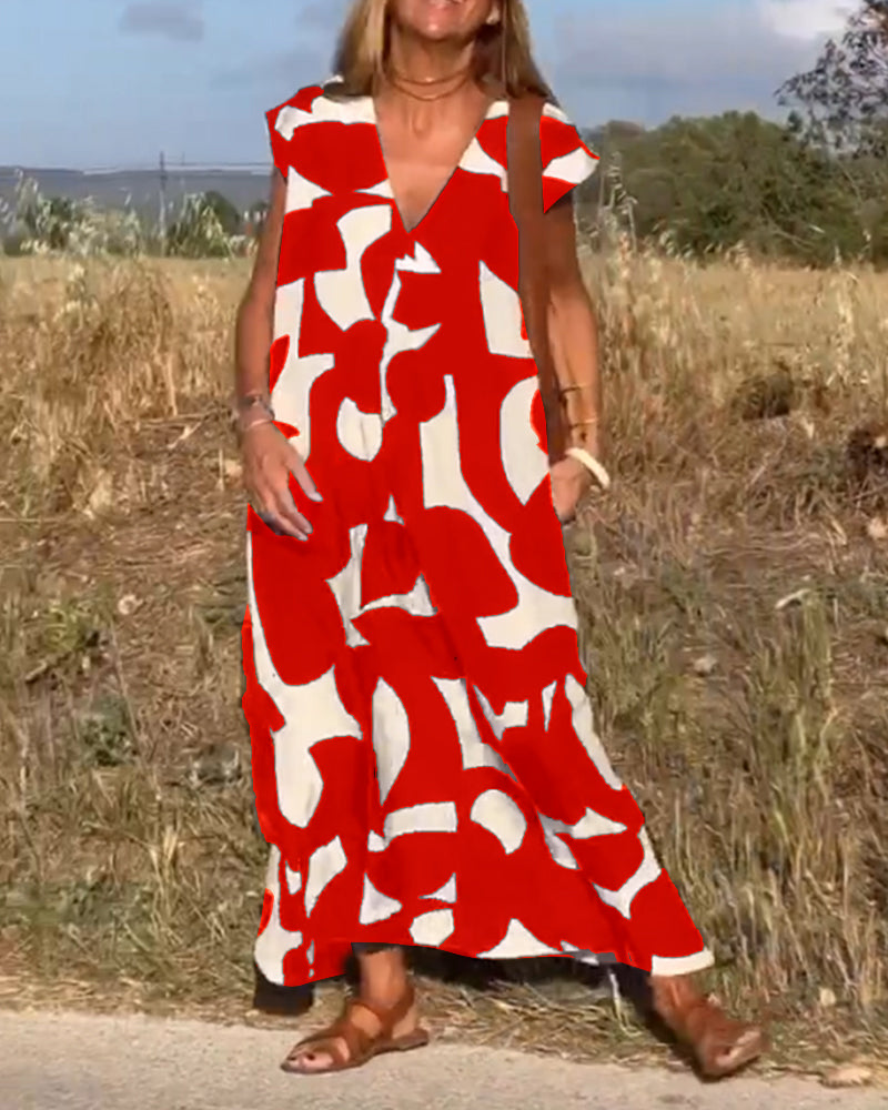 Women's casual abstract flowy dress with cap sleeves and V-neck, designed for comfort.