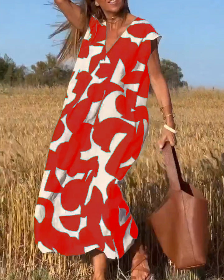 Abstract print women's dress with flowy design for summer comfort and vacation wear.