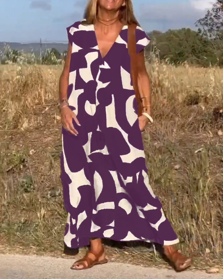 Stylish women's cap sleeve dress with abstract pattern, vacation-ready and comfortable.