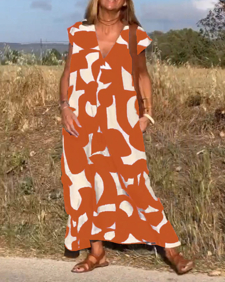 Effortless women's abstract dress, relaxed V-neck fit, perfect for vacation and everyday style.