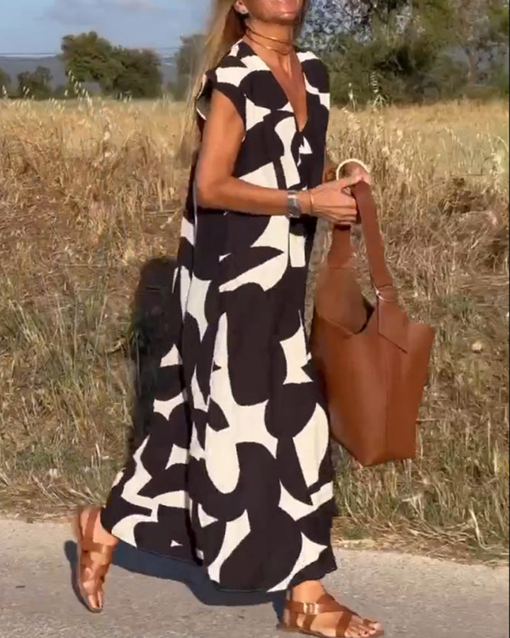 Close-up of the vibrant abstract print on a comfortable women's relaxed fit dress.