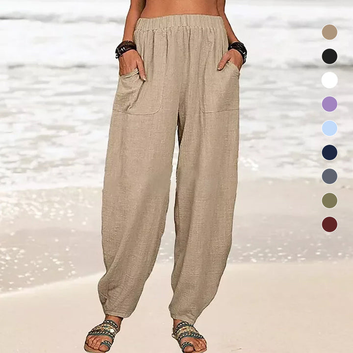 Close-up of fabric and relaxed fit details on women's comfortable summer beach harem pants.