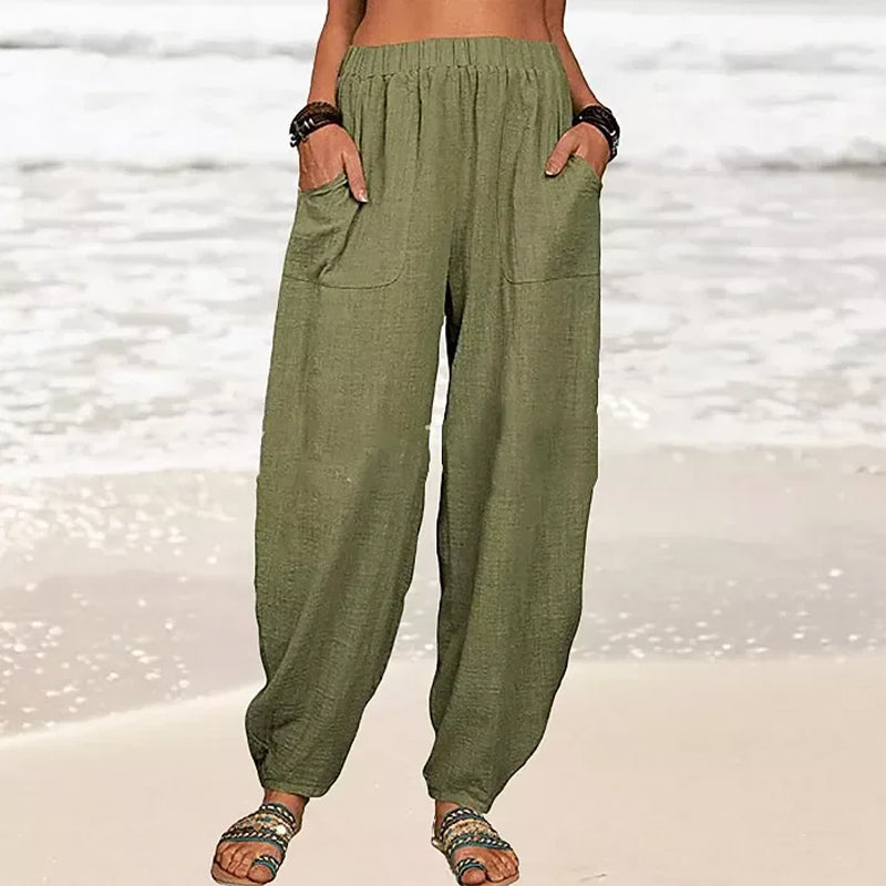 Model showcasing comfortable women's relaxed fit harem pants, perfect for summer beach & casual wear.