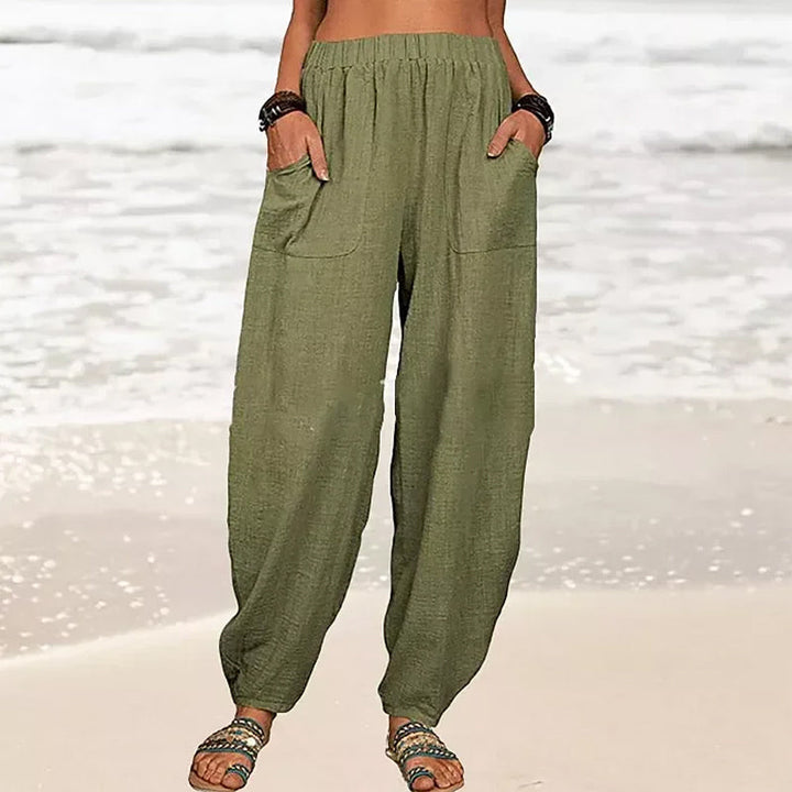 Model showcasing comfortable women's relaxed fit harem pants, perfect for summer beach & casual wear.