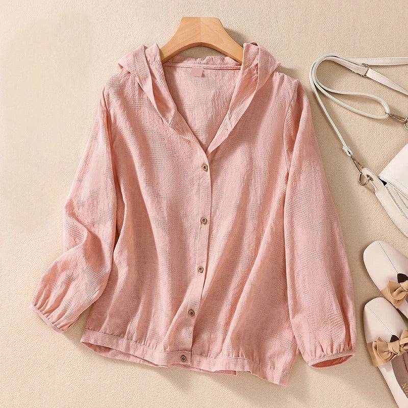 Chic women's relaxed fit hoodie with button front, perfect for casual, versatile everyday wear.