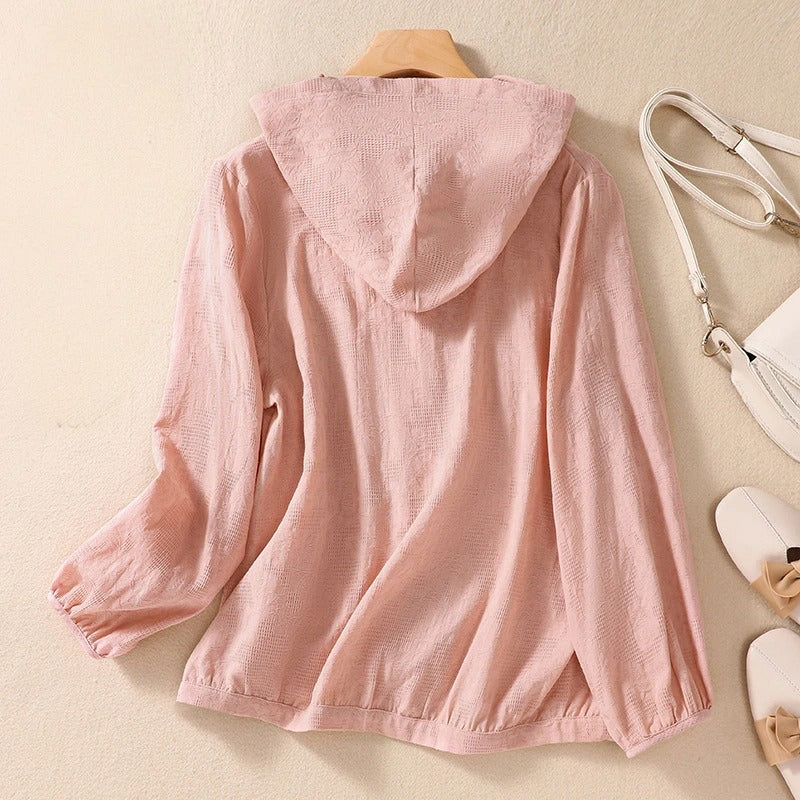 Women's long sleeve relaxed fit hoodie with button front, breathable for seasonal transition.