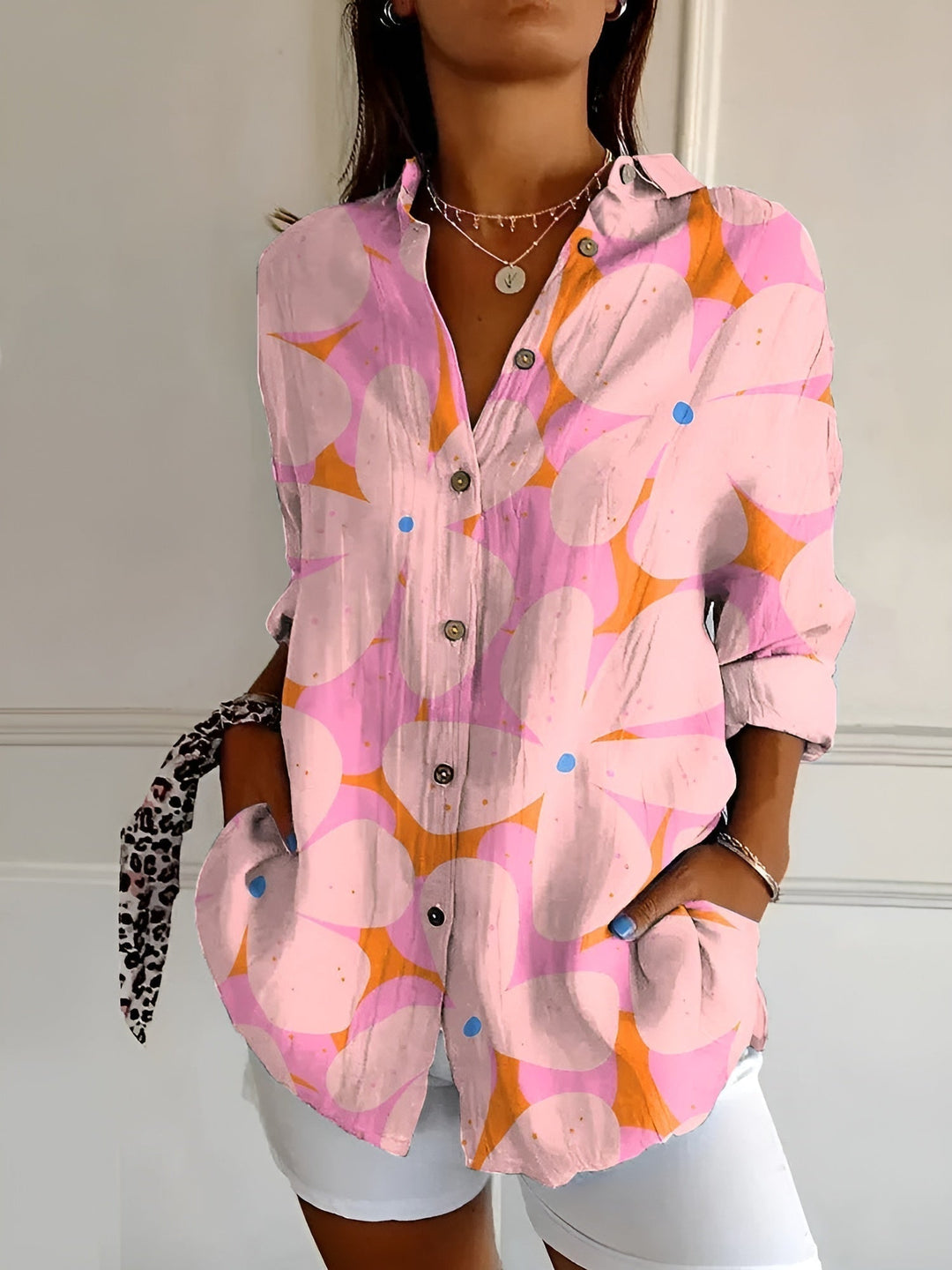 Professional women's button-down blouse. Elegant v-neck, long sleeve design, ideal workwear.