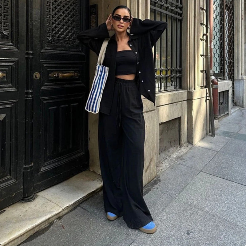 Women's chic summer matching set: relaxed button-down shirt & wide-leg pants, perfect for warm days.