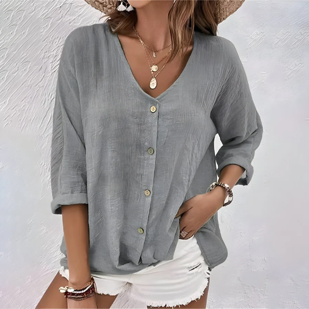 Elegant women's long sleeve button-up blouse, perfect for office wear or smart casual events. Comfortable & versatile.
