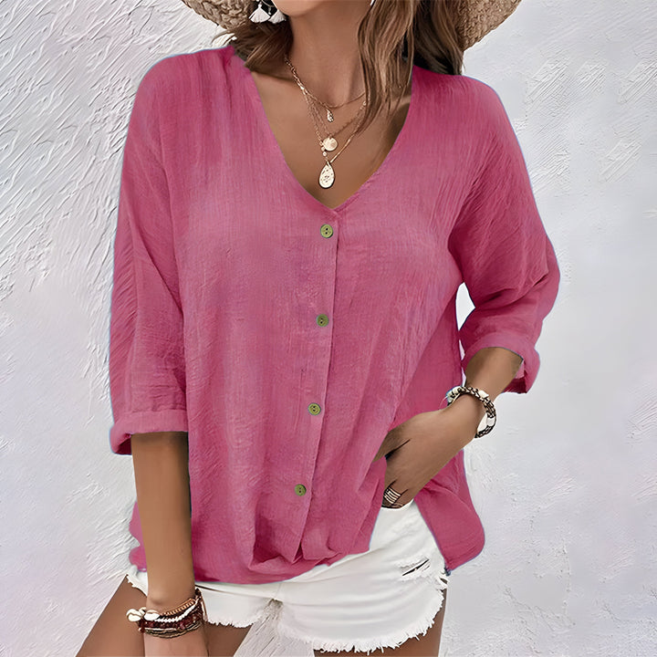 Women's relaxed fit button-up blouse, shown from back. Breathable, comfortable long sleeve top for versatile styling.