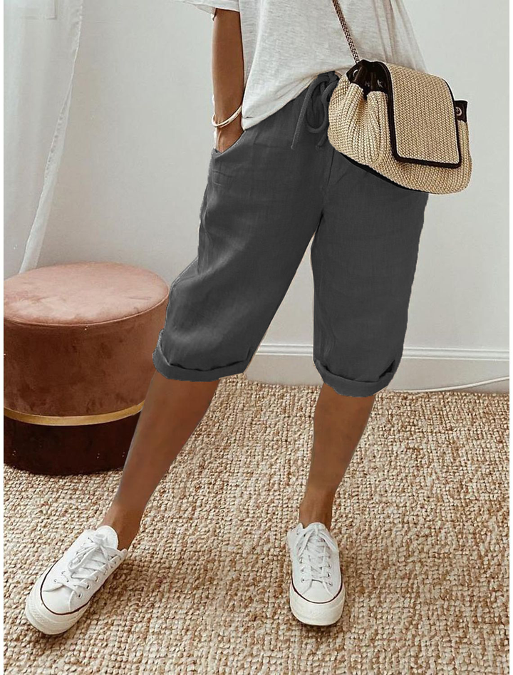 Comfortable women's relaxed fit capri trousers with elastic waist, great for summer casual versatility.