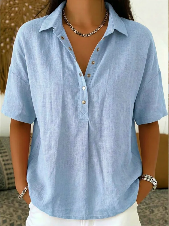 Elegant women's relaxed fit button-down shirt with collar, a must-have for spring fashion.