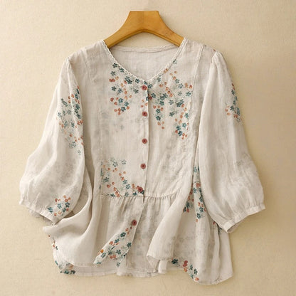 Women's relaxed fit floral blouse with long sleeves, perfect for casual spring and summer wear.