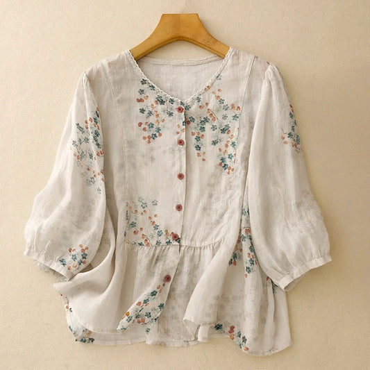 Women's relaxed fit floral blouse with long sleeves, perfect for casual spring and summer wear.