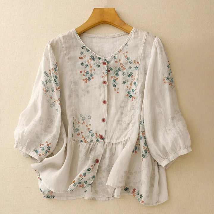 Women's relaxed fit floral blouse with long sleeves, perfect for casual spring and summer wear.