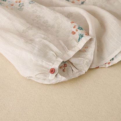 Spring/summer women's floral long-sleeve blouse, a relaxed and comfortable top for casual wear.