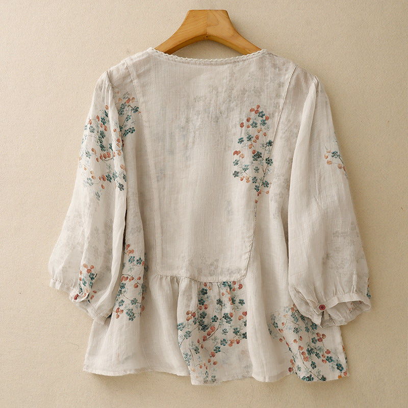 Feminine women's long-sleeve floral top, a relaxed printed blouse offering effortless spring style.