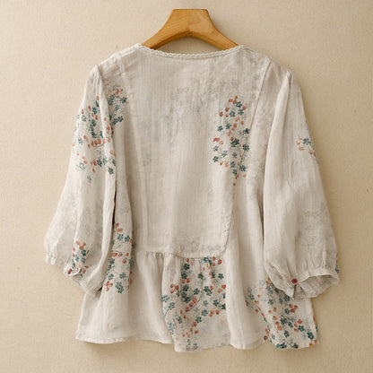 Feminine women's long-sleeve floral top, a relaxed printed blouse offering effortless spring style.