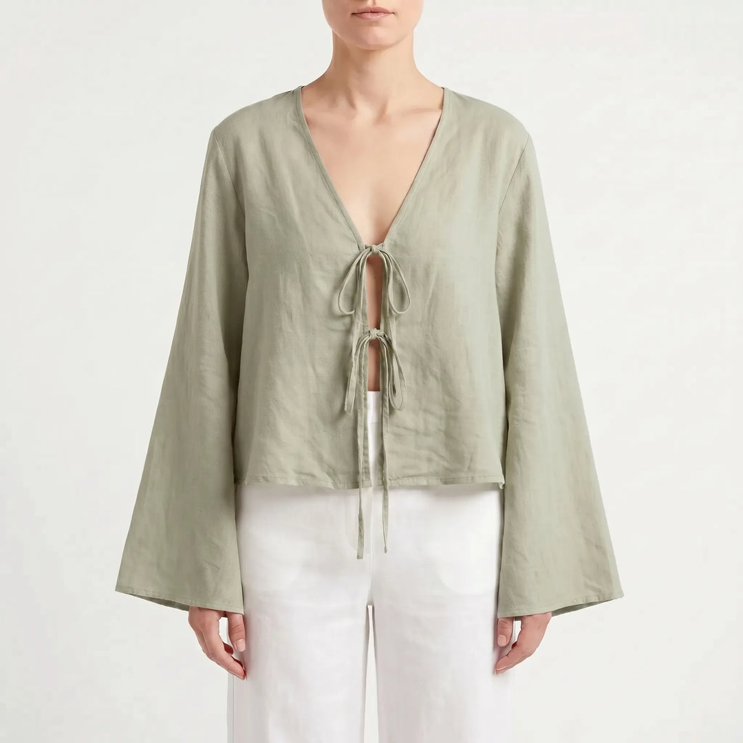 Casual women's relaxed fit summer blouse with a stylish front tie and flared sleeves. Effortless warm weather top.