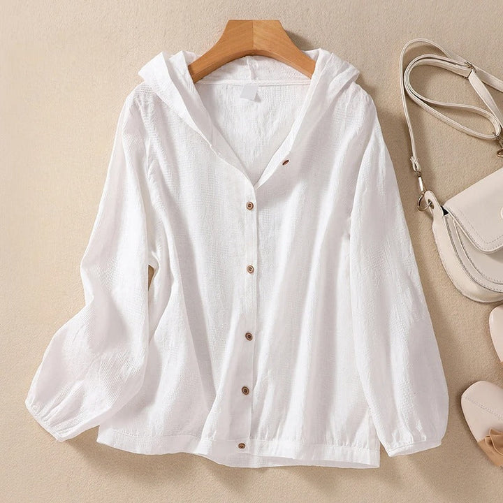 Women's relaxed fit hooded shirt for effortless everyday style. Comfortable casual layering top.