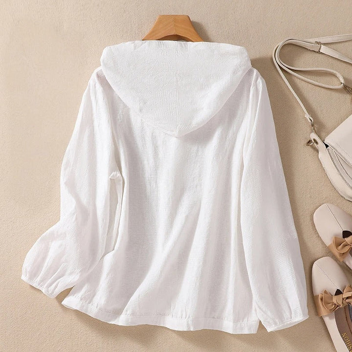 Pink women's relaxed fit hooded shirt. Soft, comfortable pullover for everyday fashion and casual wear.