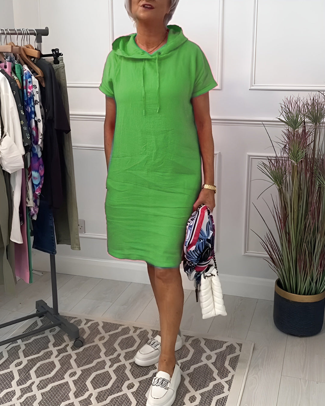 Versatile women's midi hoodie dress, relaxed fit, adjustable hood, great for any casual occasion.