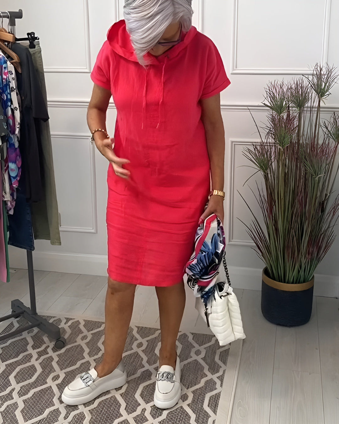Versatile women's half-sleeve hoodie midi dress in a relaxed fit with an adjustable hood.