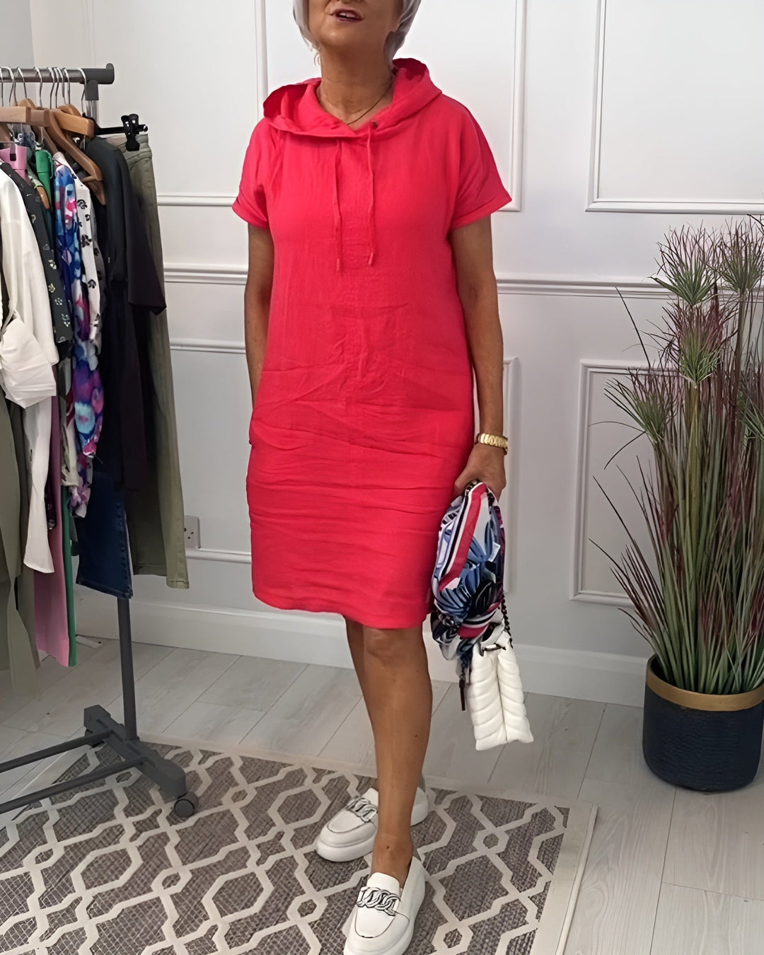 Casual women's relaxed fit midi dress with an adjustable hood, ideal for comfortable daily wear.