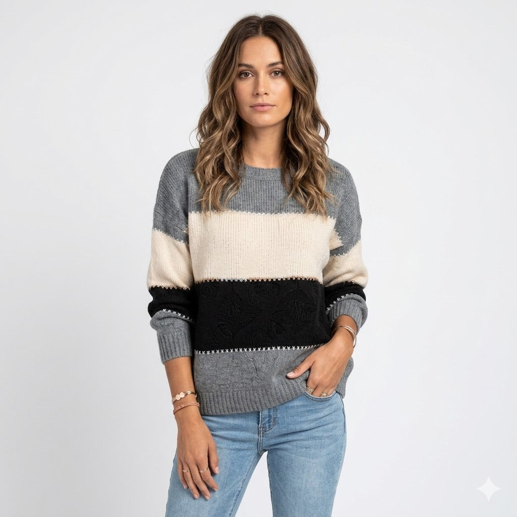 Women's relaxed fit knit sweater in cozy material with crew neck and ribbed cuffs, perfect for casual everyday wear.