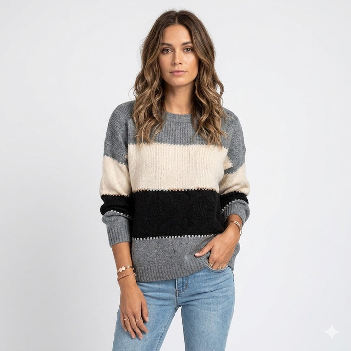 Women's relaxed fit knit sweater in cozy material with crew neck and ribbed cuffs, perfect for casual everyday wear.