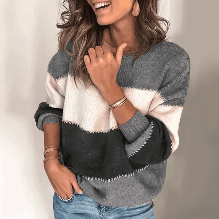 Comfortable women's relaxed fit knit sweater with crew neck and ribbed cuffs, ideal for fall & winter loungewear.