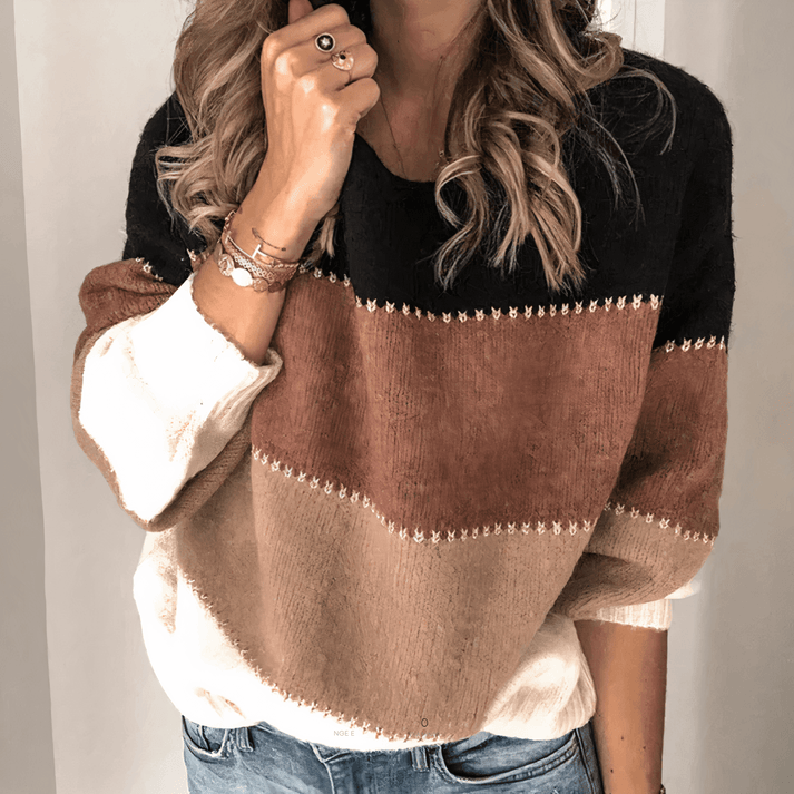 Stylish women's relaxed fit crew neck knit sweater with ribbed cuffs, offering cozy comfort for daily wear.